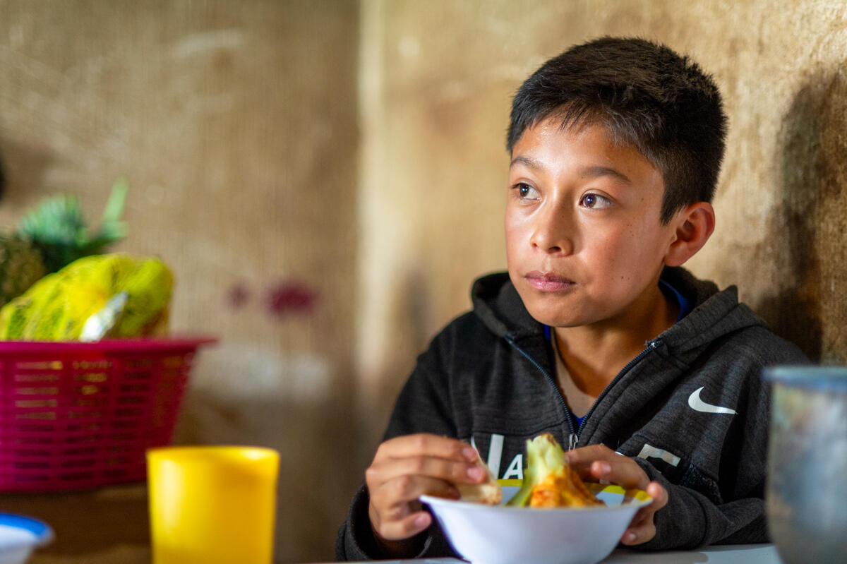 Derick (12) eats a healthy and nutritious lunch prepared by his mother Mirna at home in the municipality of Patzún, Chimaltenango, Guatemala. Photo: WFP/ Giulio d’Adamo