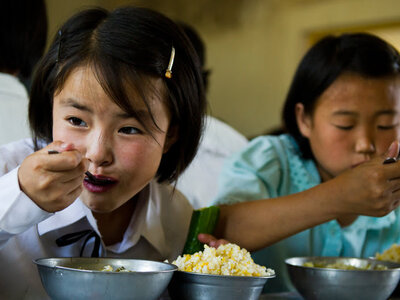 Photo: WFP/Rein Skullerud School girls eating nutritious meals provided by WFP to alleviate child malnutrition in DPR Korea