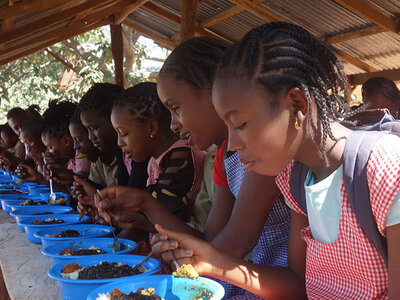 Photo: WFP/Aurelie Lecrivain School children eating nutritious meal