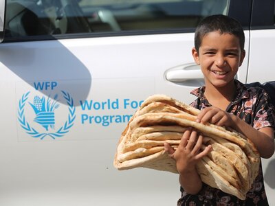 Photo: WFP/Mohammad Khodabakhsh WFP distributes wheat flour to all the refugees residing inside settlements.