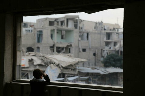 A child looks out of a window