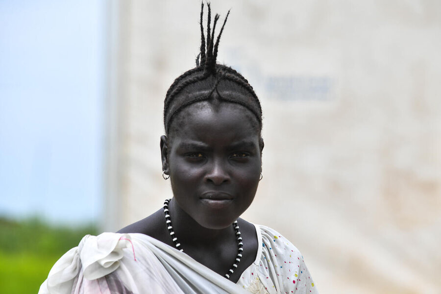 Striking shot of young South Sudanese refugee in Ethiopia, hair spiked, looking into the camera