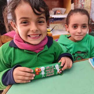 WFP provides nutritional daily in-school snacks in the form of date bars, helping secure 25 percent of their daily nutritional needs. 