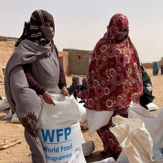 Sahrawi refugee women lead the monthly distribution of food assistance. Photo: WFP/Ayoub Boudjella 