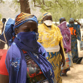 Women queuing to take food assistance distributed by WFP in response to climate and violent crises shocks in Cameroon